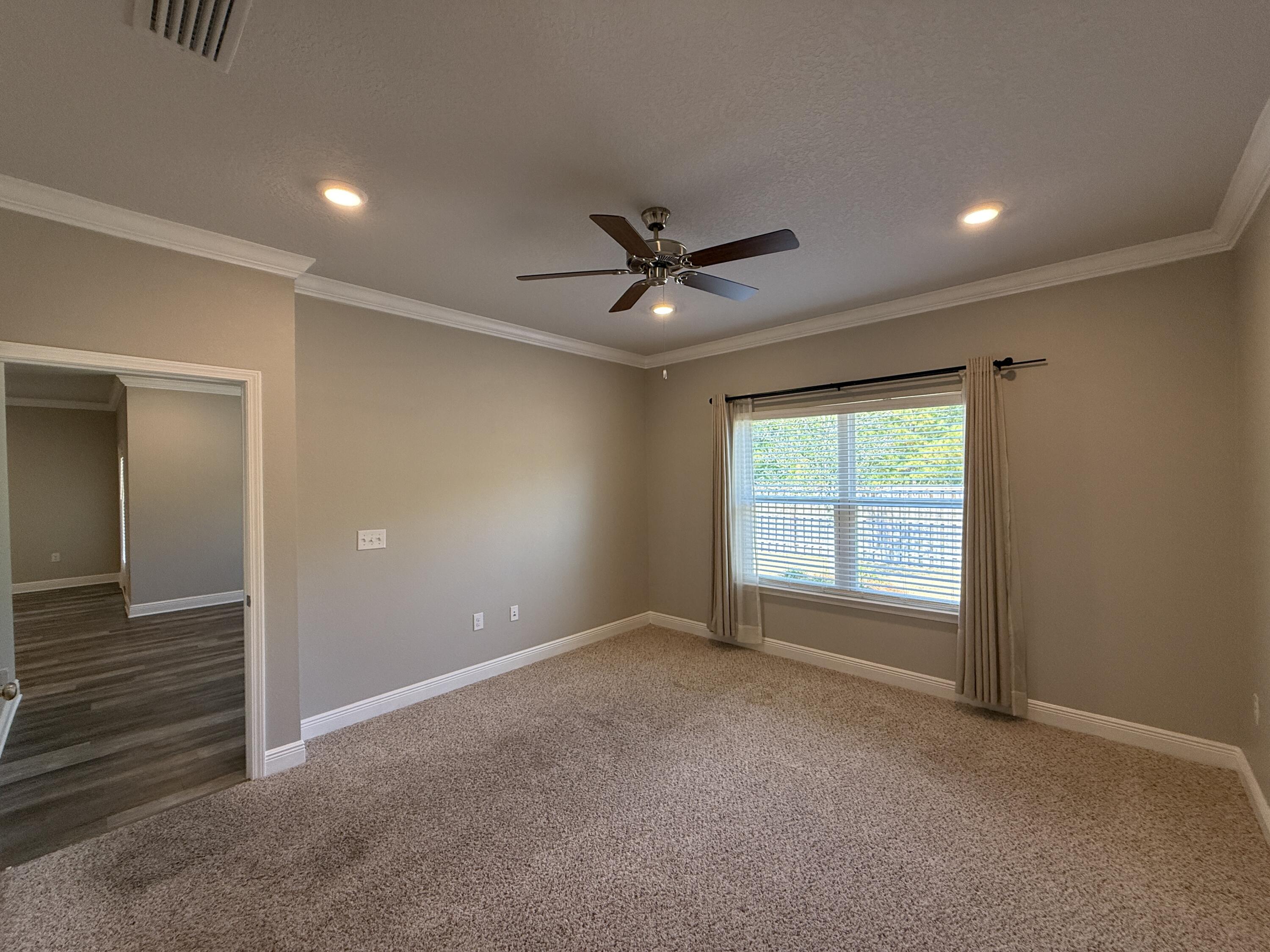 491 Lightning Bug Lane, Unit LOT 11 Freeport, FL 32439 - Photo 23 of 34 a view of an empty room with a window