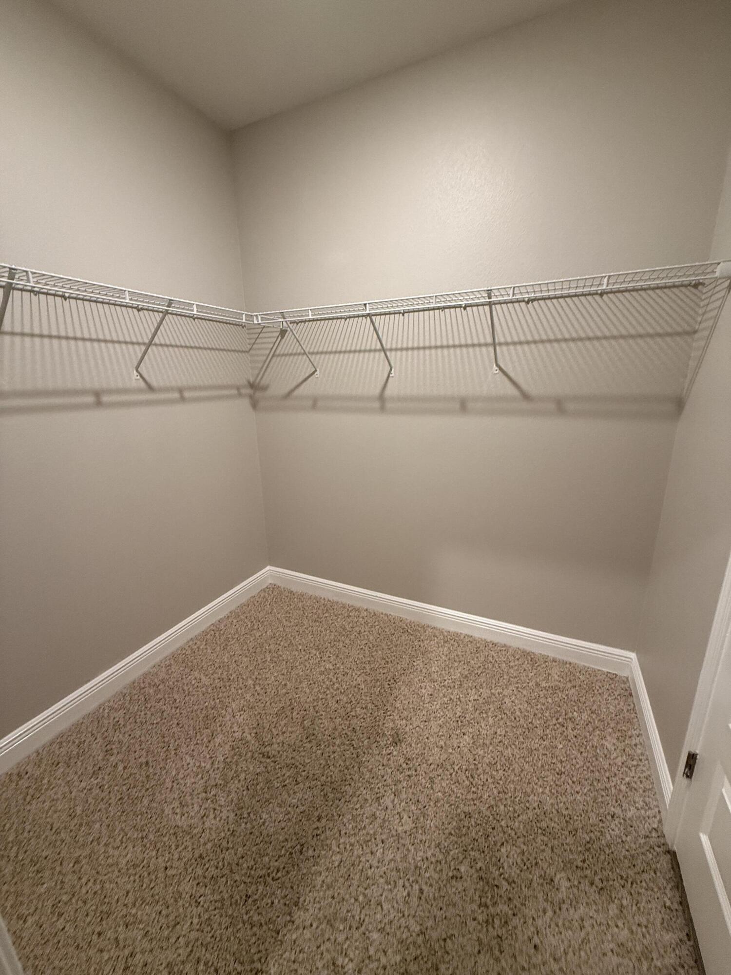 491 Lightning Bug Lane, Unit LOT 11 Freeport, FL 32439 - Photo 30 of 34 a view of a room with racks on the wall