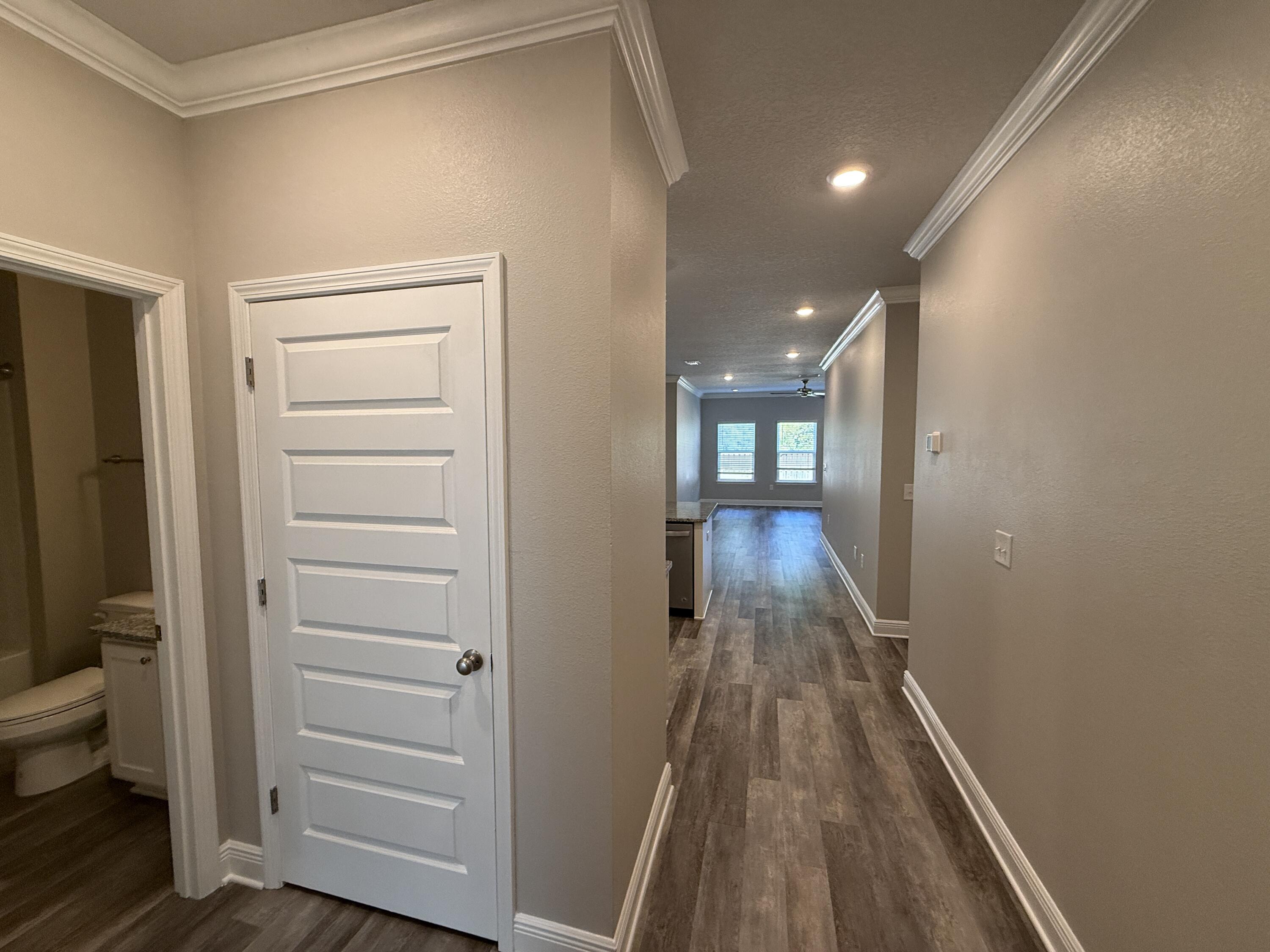 491 Lightning Bug Lane, Unit LOT 11 Freeport, FL 32439 - Photo 3 of 34 a view of a hallway with wooden floor and closet