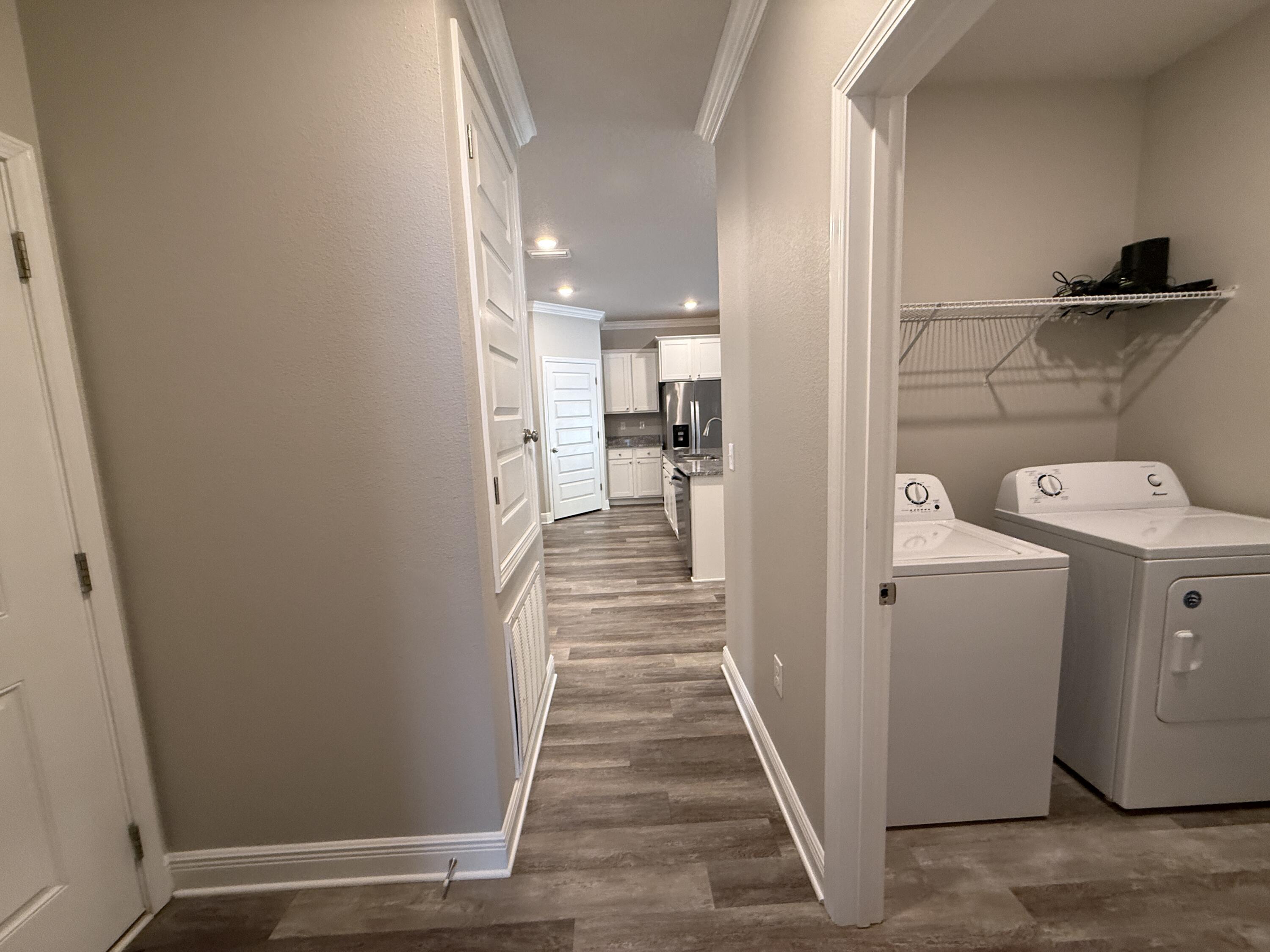 491 Lightning Bug Lane, Unit LOT 11 Freeport, FL 32439 - Photo 34 of 34 a view of a hallway with wooden floor and closet