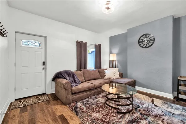 a living room with furniture and a rug