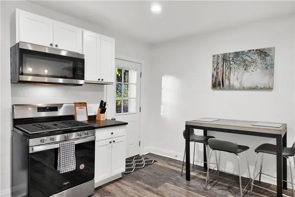 a kitchen with a stove and a microwave