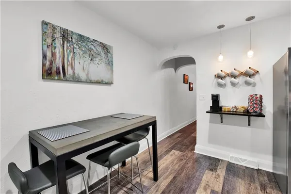 a living room with furniture and a mirror