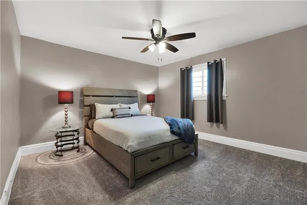 a bedroom with a bed and window