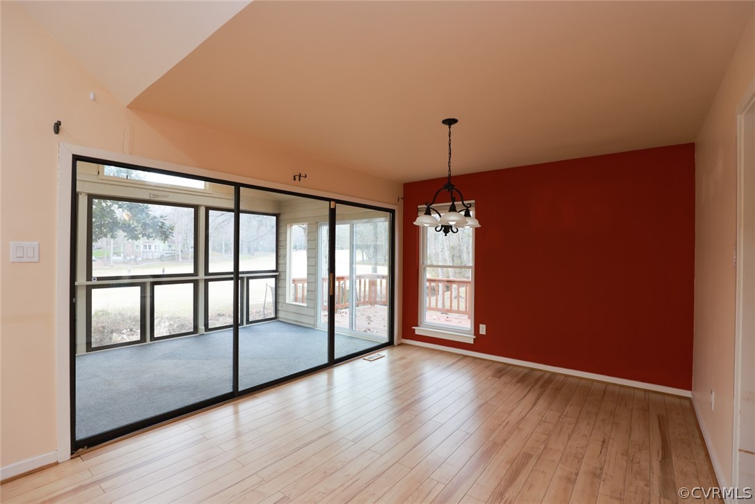 3024 3 Bridges Road Midlothian, VA 23112 - Photo 11 of 50 a view of an empty room with window and wooden floor
