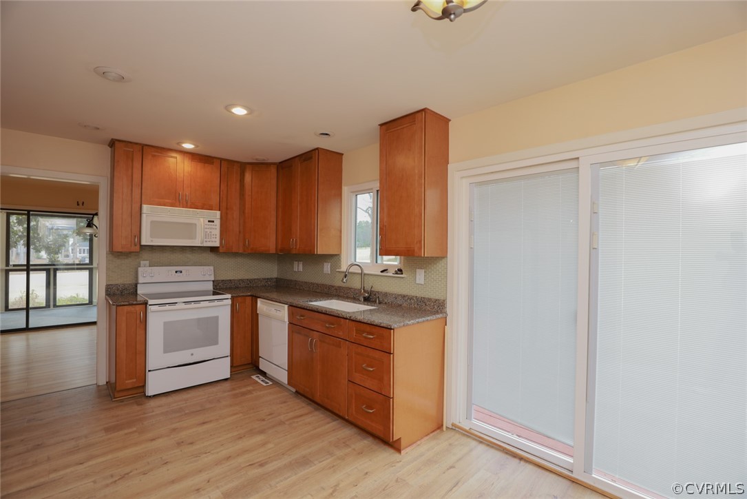 3024 3 Bridges Road Midlothian, VA 23112 - Photo 14 of 50 a kitchen with stainless steel appliances granite countertop a stove a sink and a refrigerator