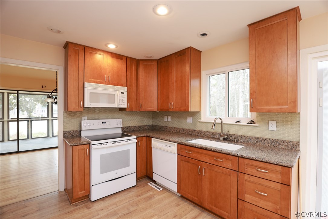 3024 3 Bridges Road Midlothian, VA 23112 - Photo 16 of 50 a kitchen with a sink stove and cabinets