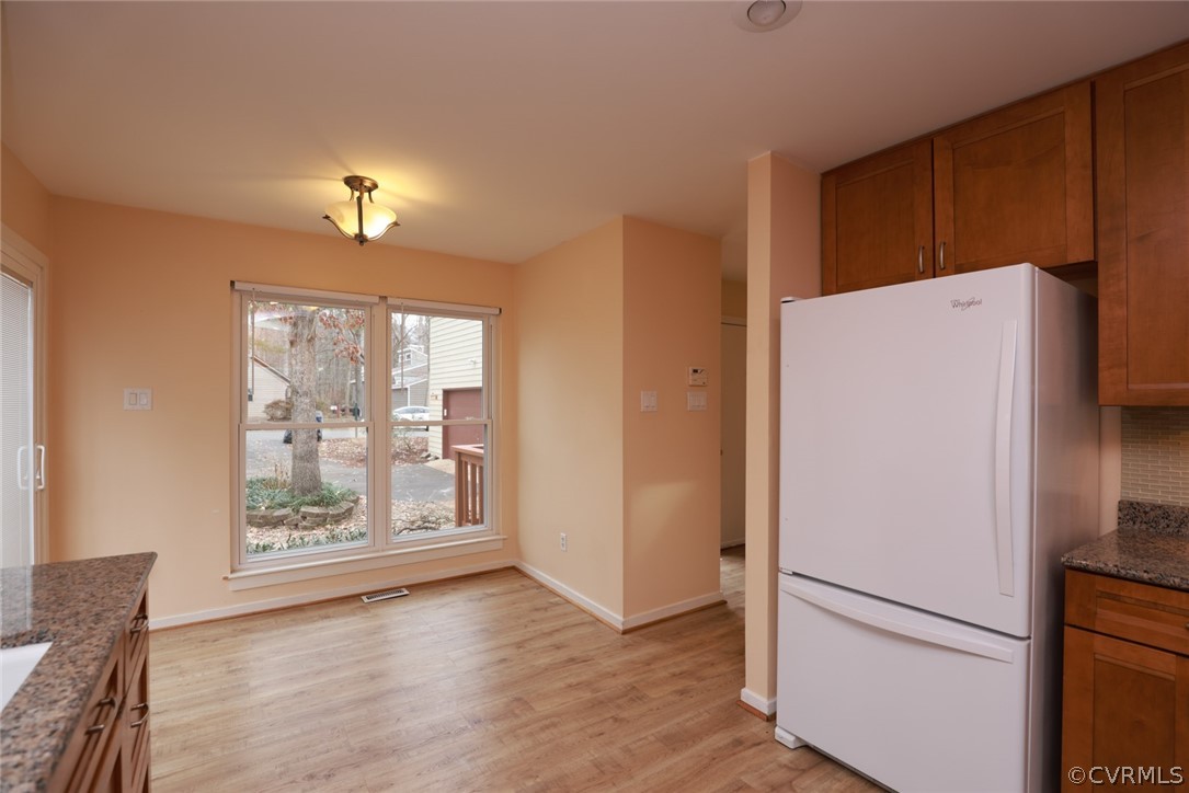 3024 3 Bridges Road Midlothian, VA 23112 - Photo 17 of 50 a view of kitchen with refrigerator and wooden floor