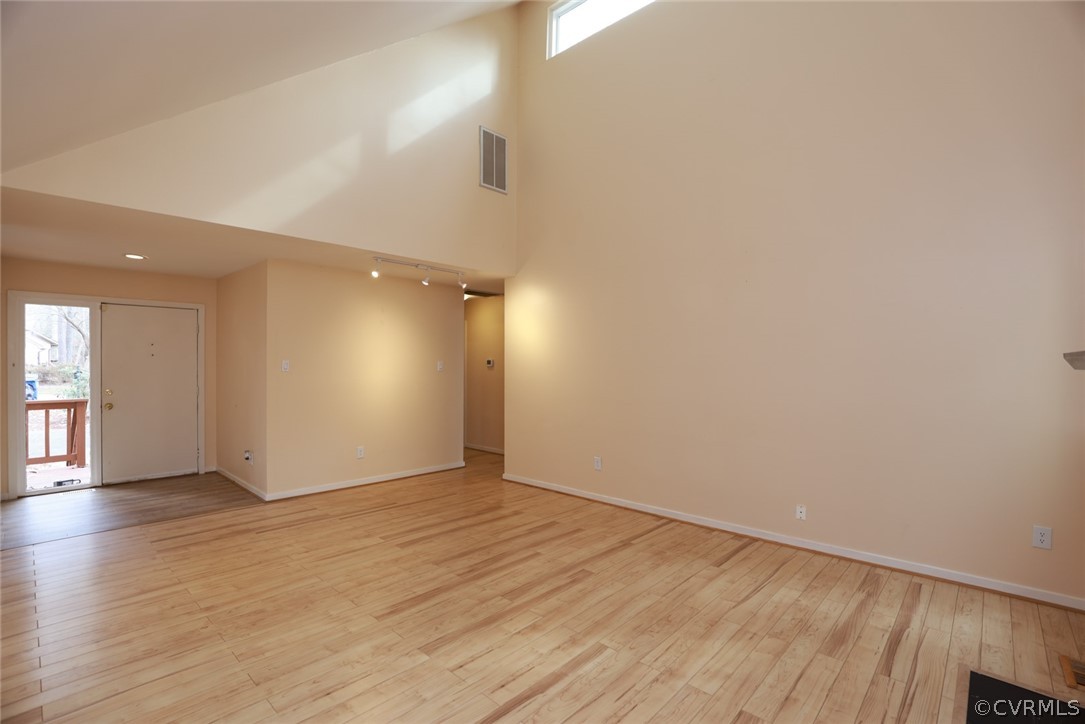 3024 3 Bridges Road Midlothian, VA 23112 - Photo 18 of 50 a view of an empty room with wooden floor and a window