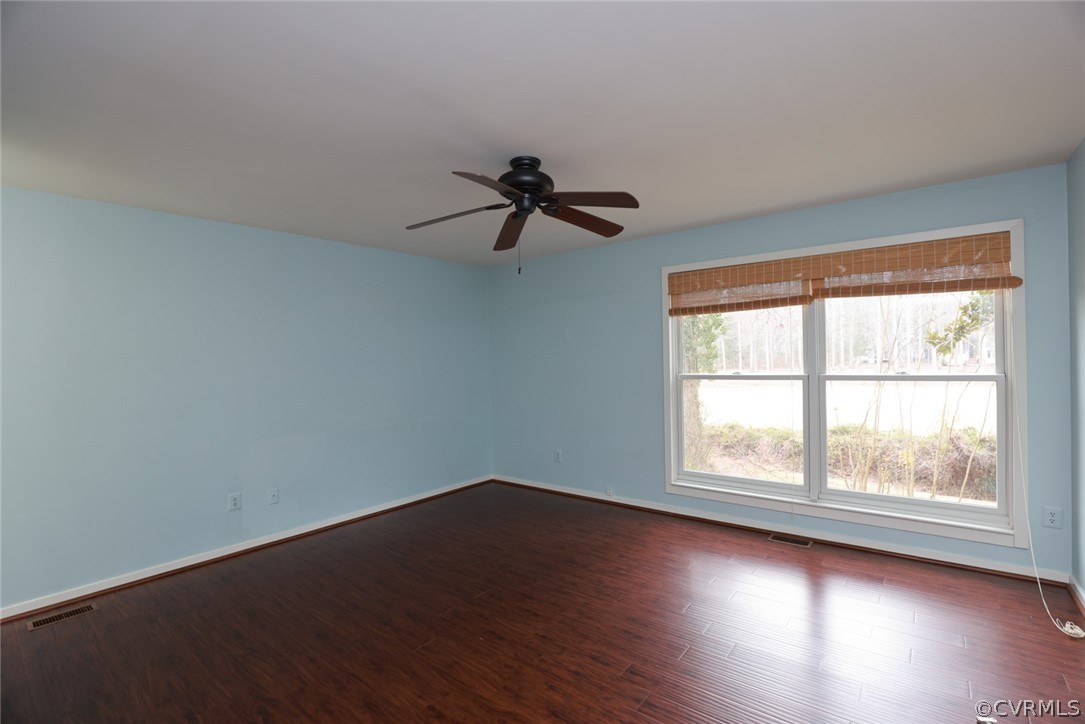 3024 3 Bridges Road Midlothian, VA 23112 - Photo 20 of 50 an empty room with wooden floor fan and windows
