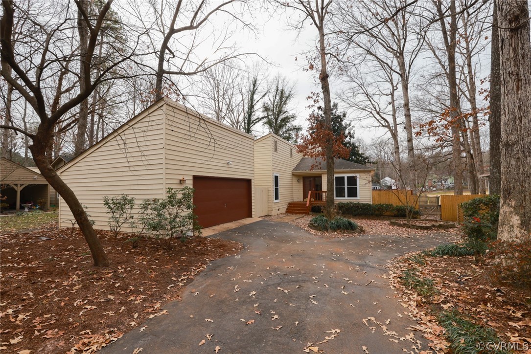 3024 3 Bridges Road Midlothian, VA 23112 - Photo 2 of 50 a front view of a house with garden