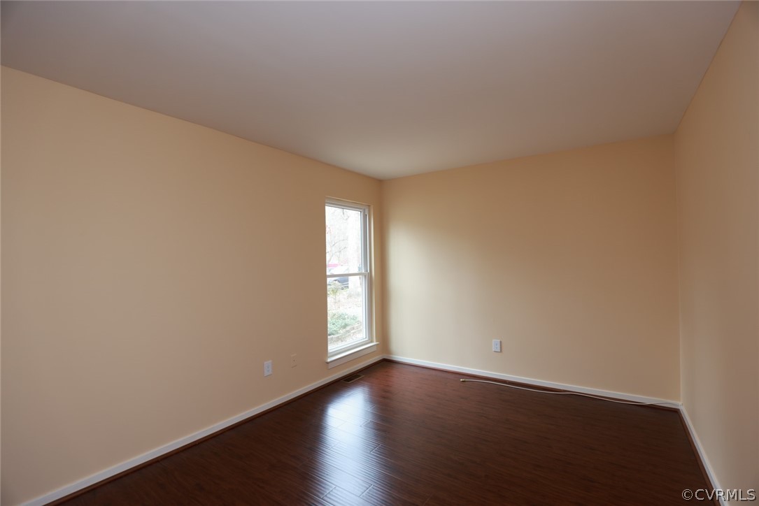 3024 3 Bridges Road Midlothian, VA 23112 - Photo 28 of 50 an empty room with wooden floor and windows