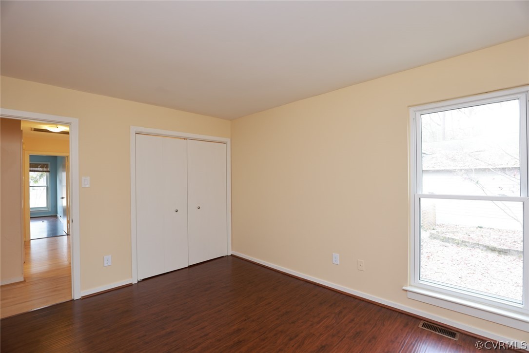3024 3 Bridges Road Midlothian, VA 23112 - Photo 29 of 50 a view of an empty room with wooden floor and a window