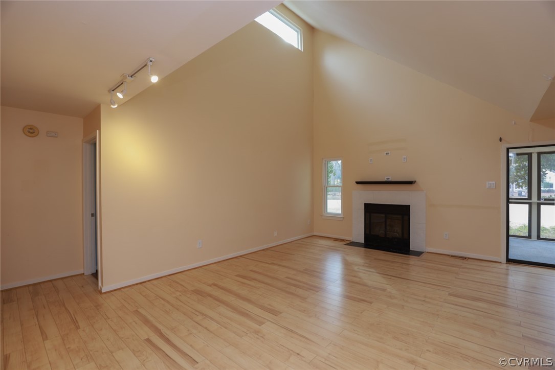 3024 3 Bridges Road Midlothian, VA 23112 - Photo 6 of 50 a view of empty room with wooden floor and fireplace