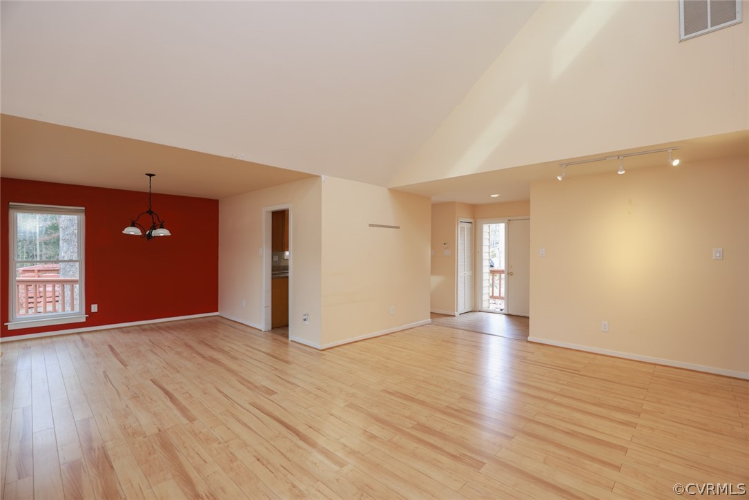 3024 3 Bridges Road Midlothian, VA 23112 - Photo 9 of 50 a view of an empty room with wooden floor and windows