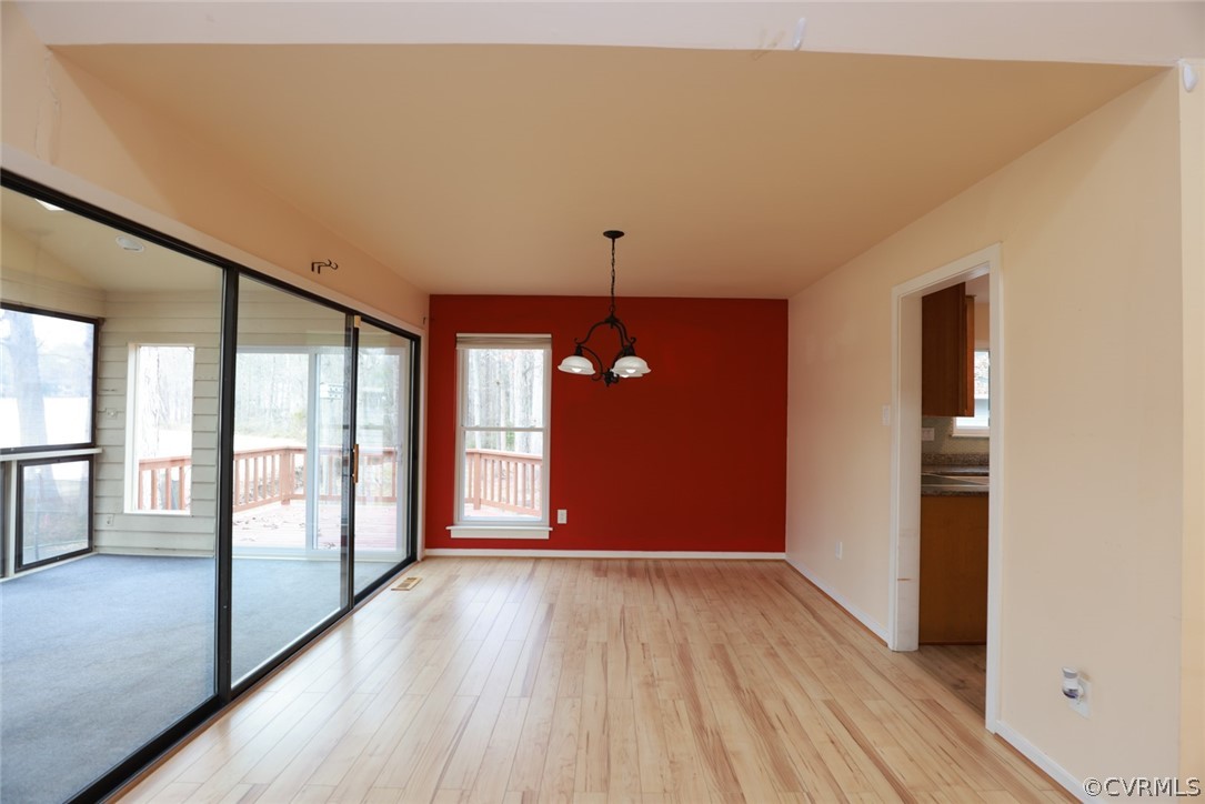3024 3 Bridges Road Midlothian, VA 23112 - Photo 10 of 50 a view of empty room with wooden floor and fan