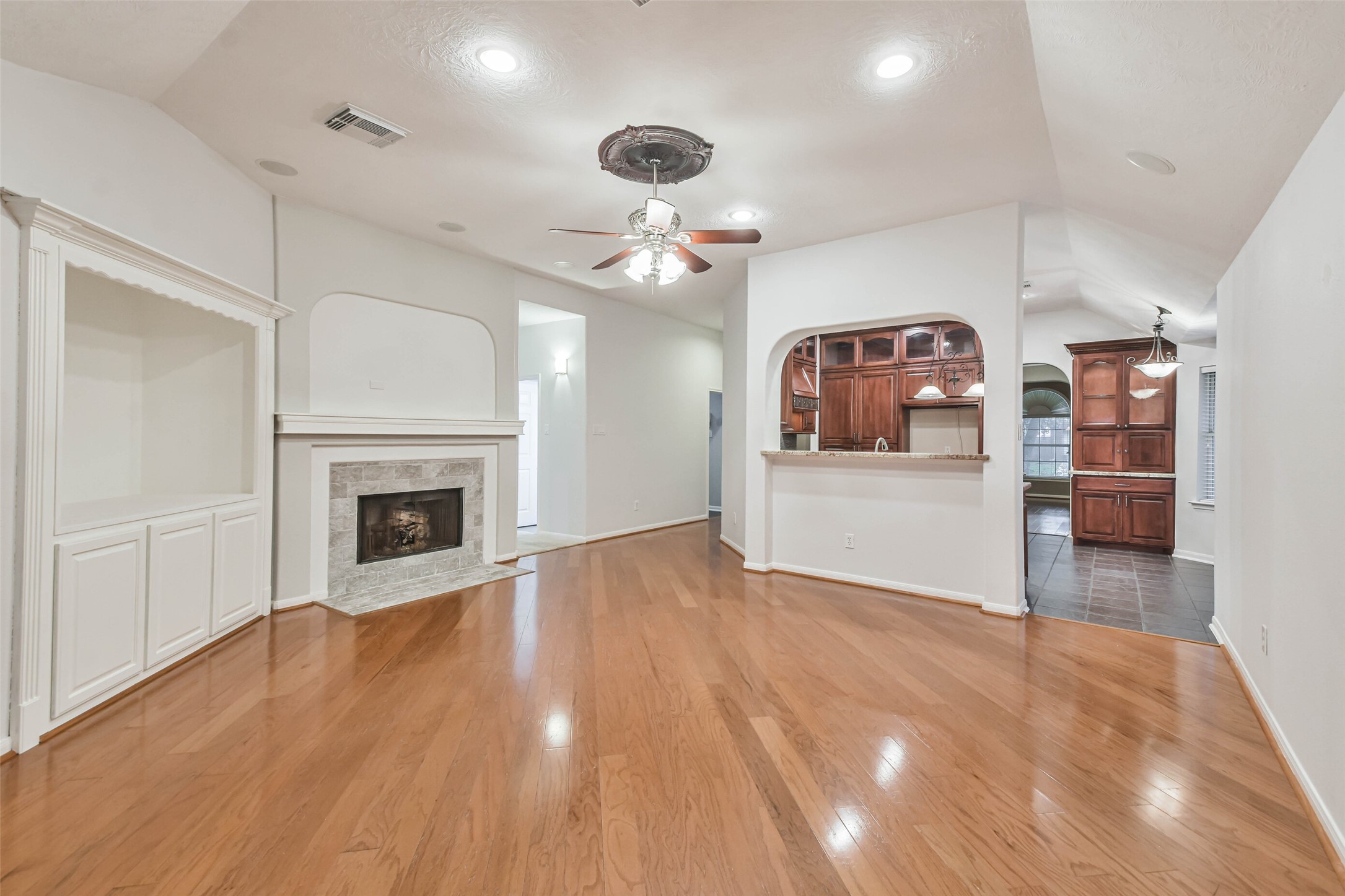 20942 Wind Field Lane Spring, TX 77379 - Photo 23 of 46 a view of a livingroom with a fireplace and cabinet