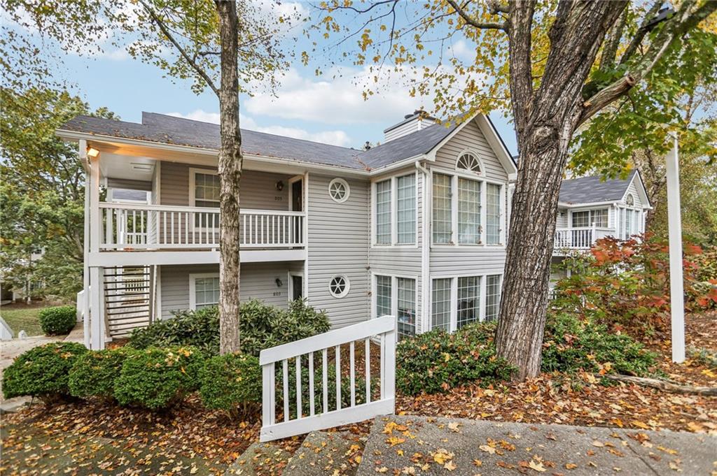 801 Countryside Place Smyrna, GA 30080 - Photo 1 of 34 a front view of a house with garden