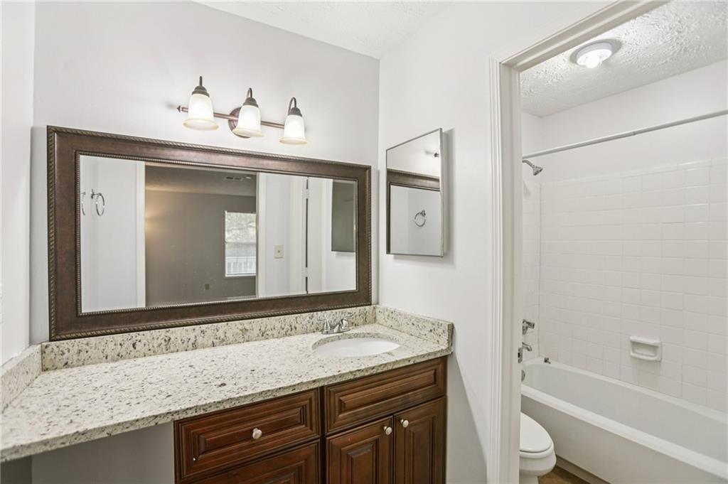 801 Countryside Place Smyrna, GA 30080 - Photo 14 of 34 a bathroom with a sink and a mirror
