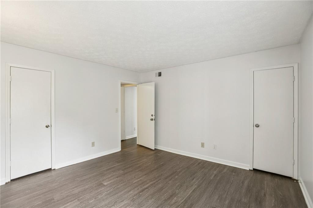 801 Countryside Place Smyrna, GA 30080 - Photo 16 of 34 a view of an empty room with wooden floor