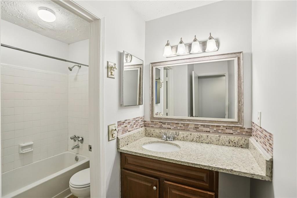 801 Countryside Place Smyrna, GA 30080 - Photo 17 of 34 a bathroom with a sink and a bathtub