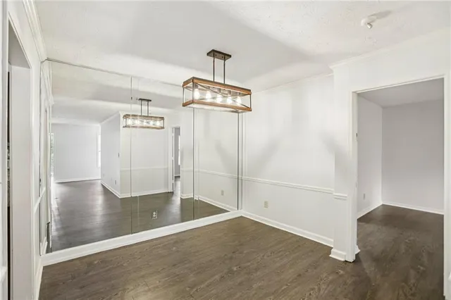 a view of a livingroom with wooden floor