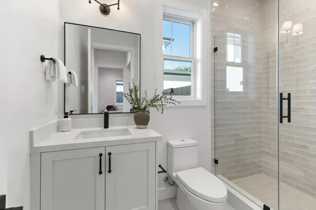 a spacious bedroom with a bed and a large window