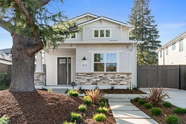 a front view of a house with a garden