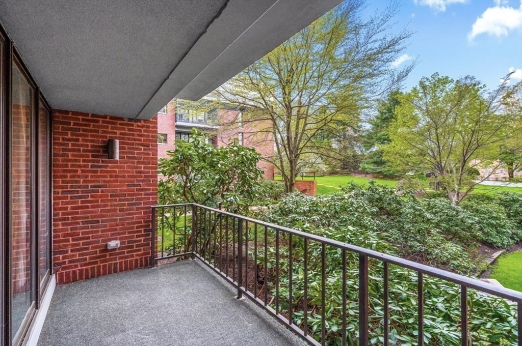 65 Grove Wellesley Ma, Unit 152 Wellesley, MA 02482 - Photo 13 of 16 a view of a balcony with an outdoor space