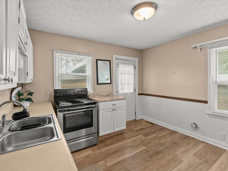 4624 Macland Road Hiram, GA 30141 - Photo 11 of 12 a kitchen with a stove and a sink