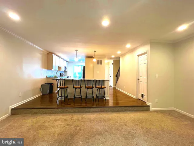 a view of kitchen with furniture and floor to ceiling window