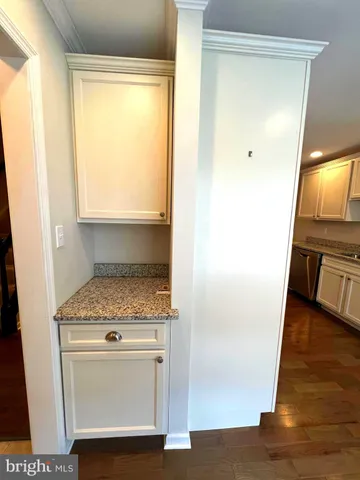 a view of washer and dryer with wooden floor