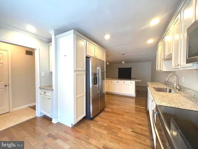 a bathroom with a sink a mirror and a shower