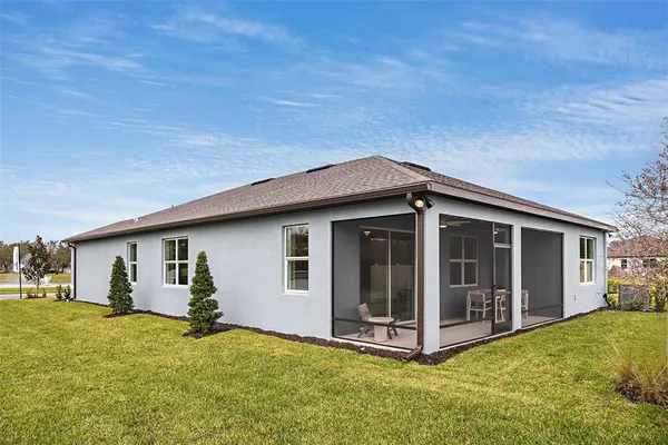 a view of a house with yard and garage