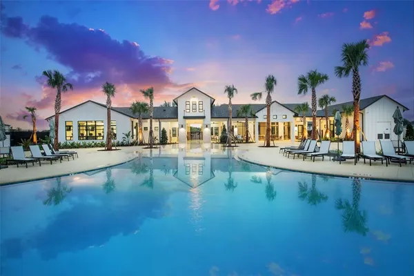 a view of swimming pool with outdoor seating
