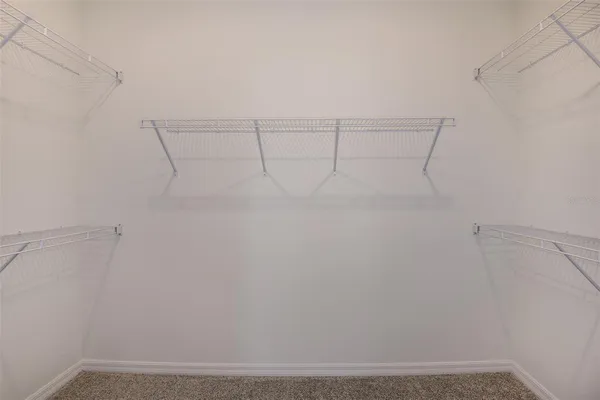 a view of a room with racks on the wall