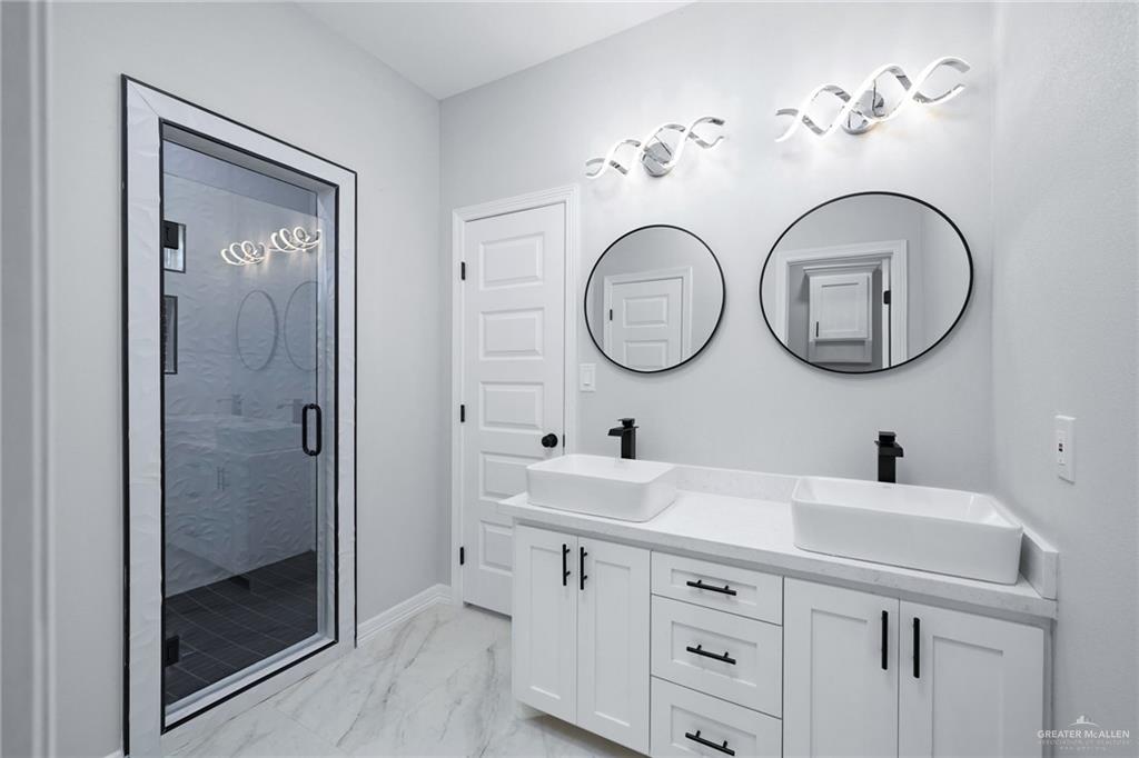 210 Bernie Rio Grande City, TX 78582 - Photo 12 of 20 a bathroom with a sink and a mirror