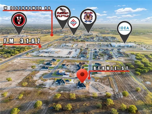 a spacious bathroom with double sink and a mirror