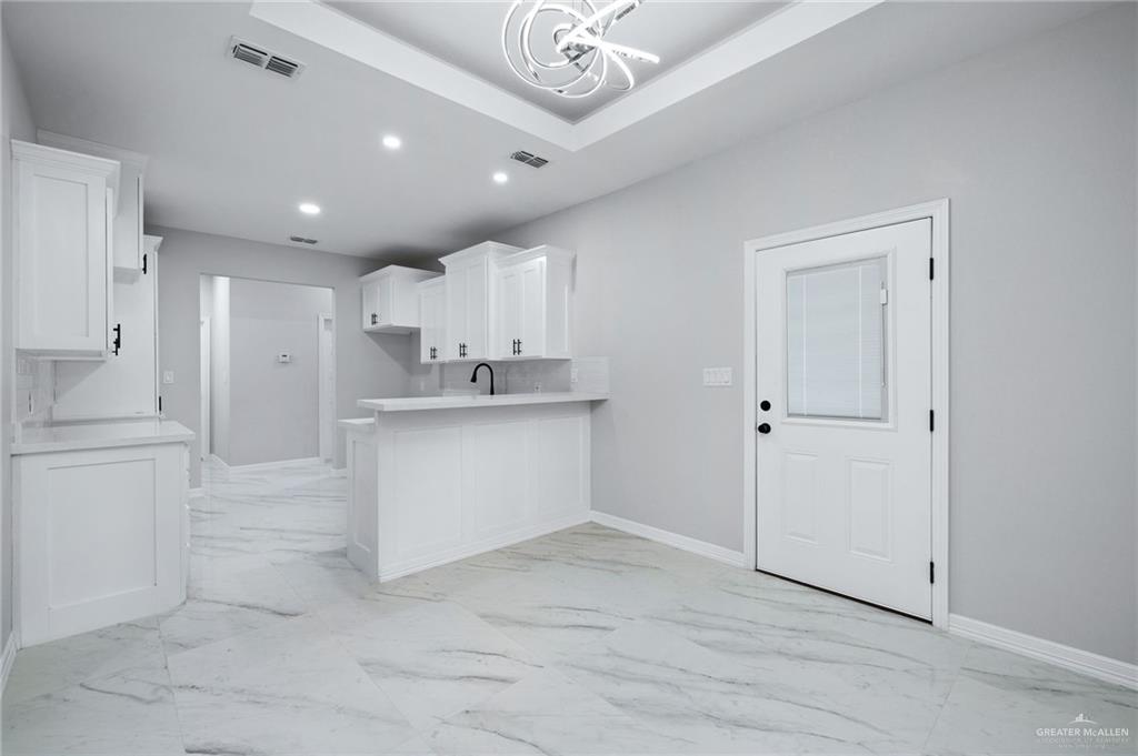 210 Bernie Rio Grande City, TX 78582 - Photo 8 of 20 a view of kitchen with center island and stainless steel appliances