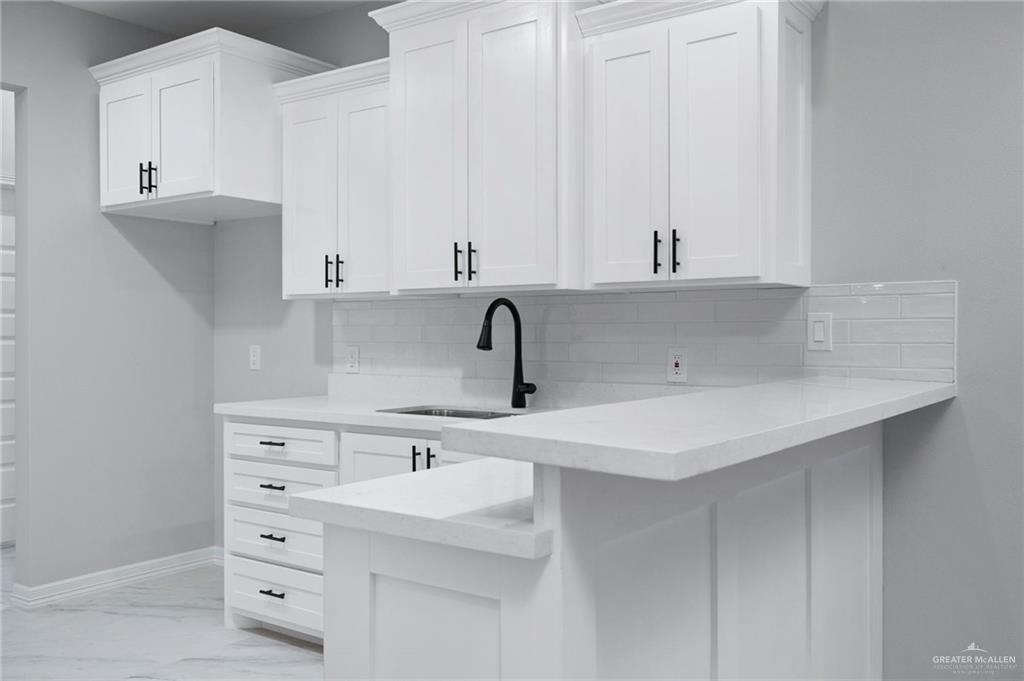 210 Bernie Rio Grande City, TX 78582 - Photo 9 of 20 a kitchen with cabinets appliances and a sink