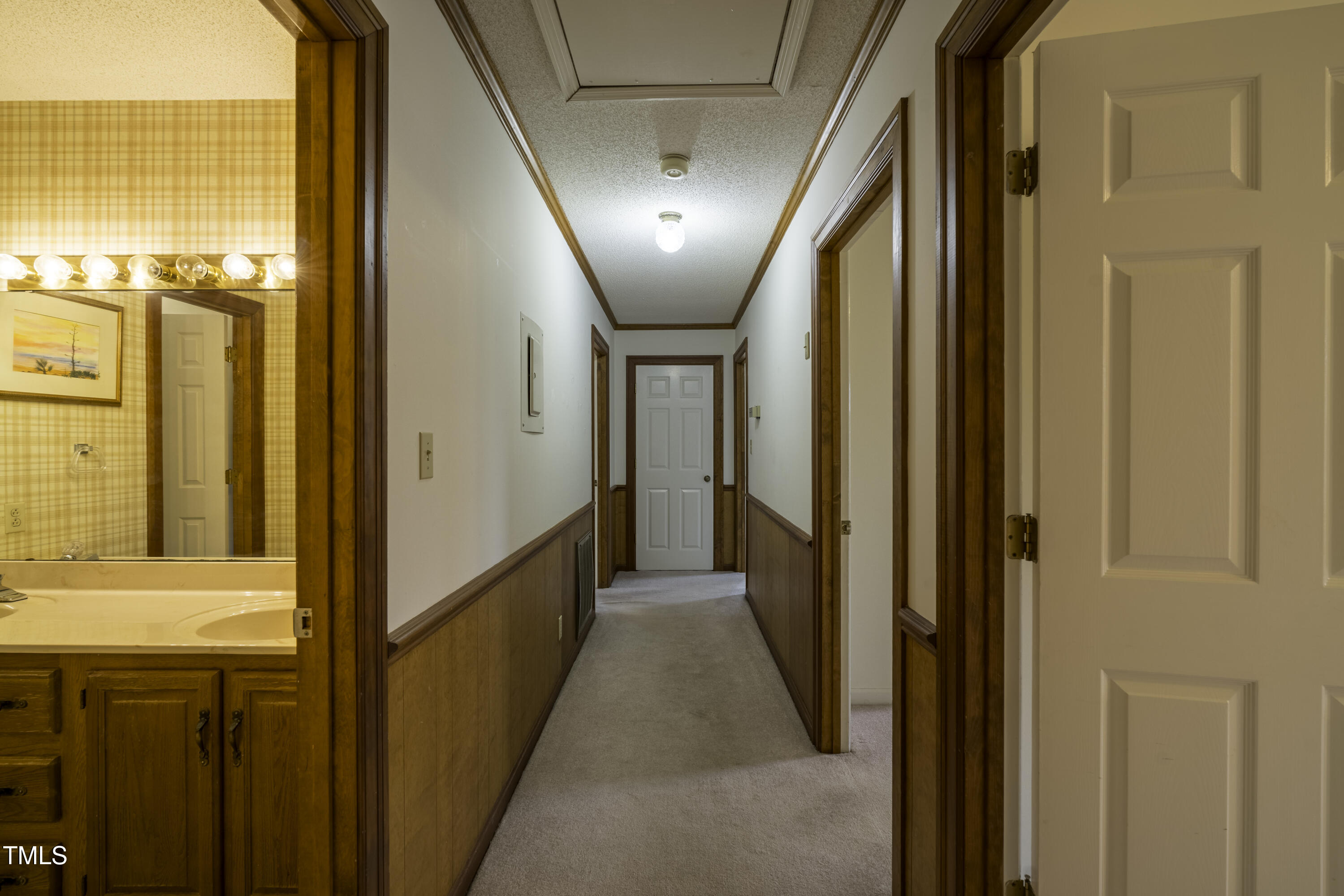 610 Denim Drive Erwin, NC 28339 - Photo 21 of 49 a view of a hallway with wooden floor and staircase
