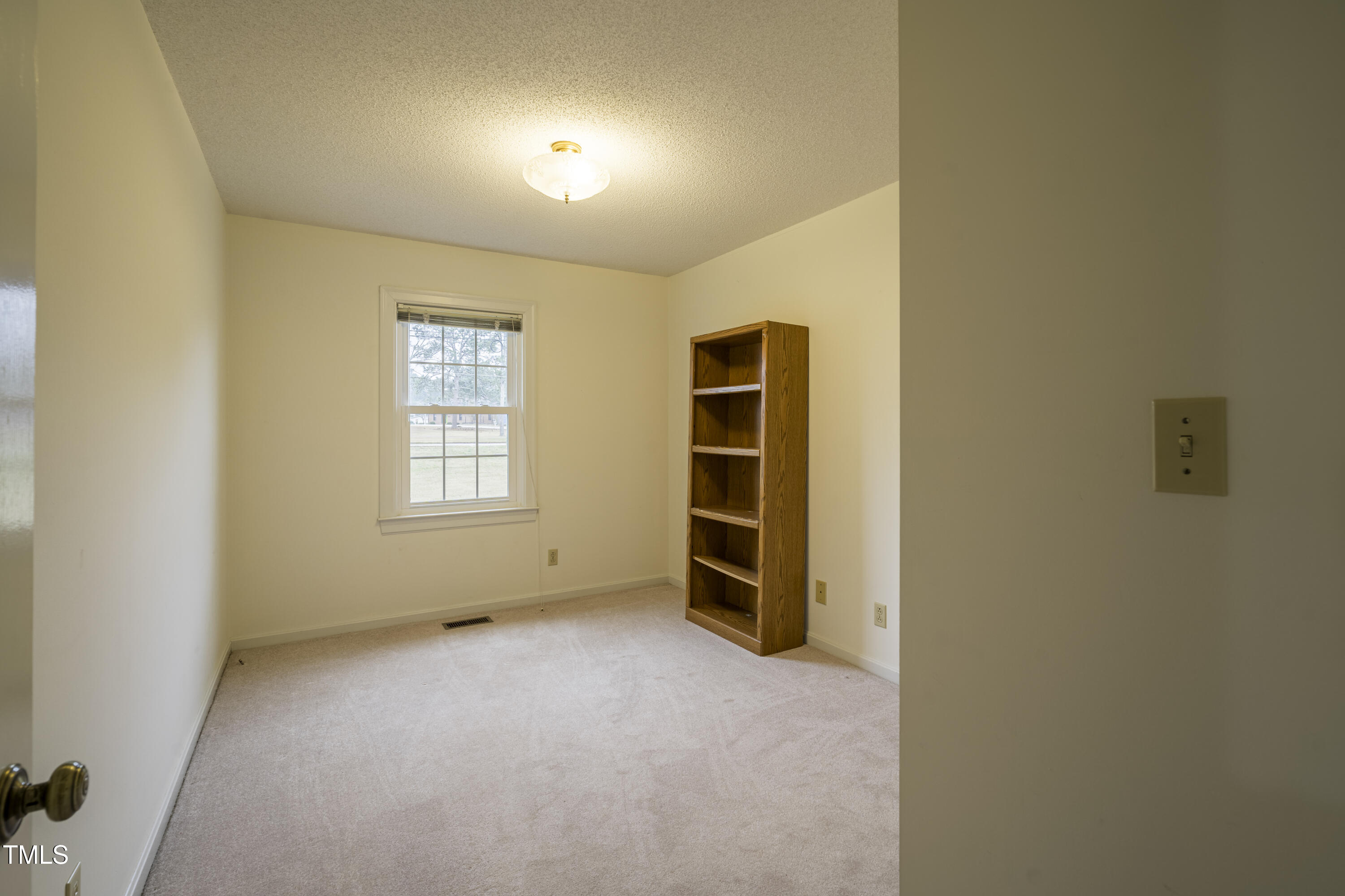 610 Denim Drive Erwin, NC 28339 - Photo 25 of 49 an empty room with a empty space and windows