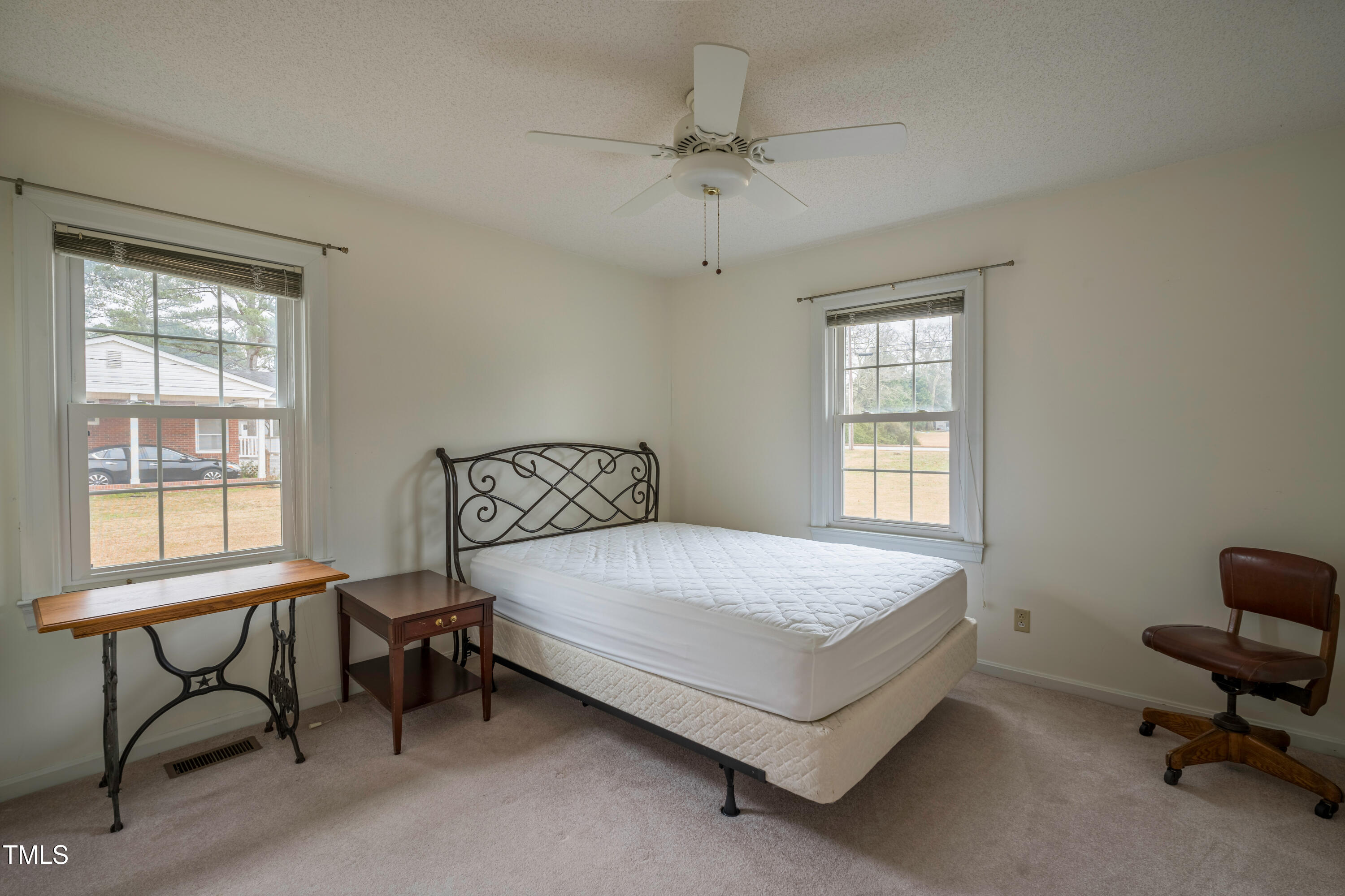 610 Denim Drive Erwin, NC 28339 - Photo 29 of 49 a bedroom with a bed a table and chair