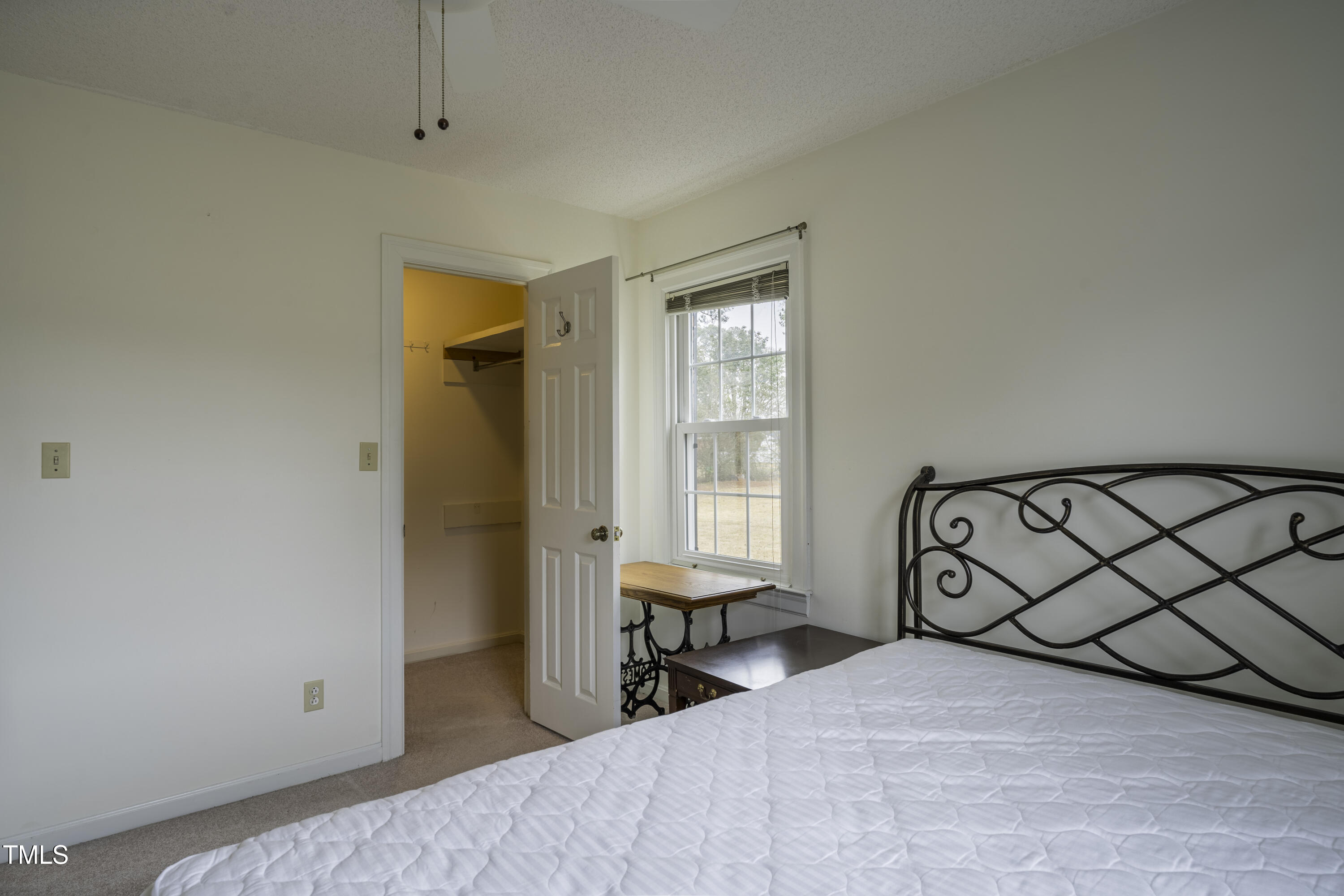 610 Denim Drive Erwin, NC 28339 - Photo 30 of 49 a bedroom with a bed and a window