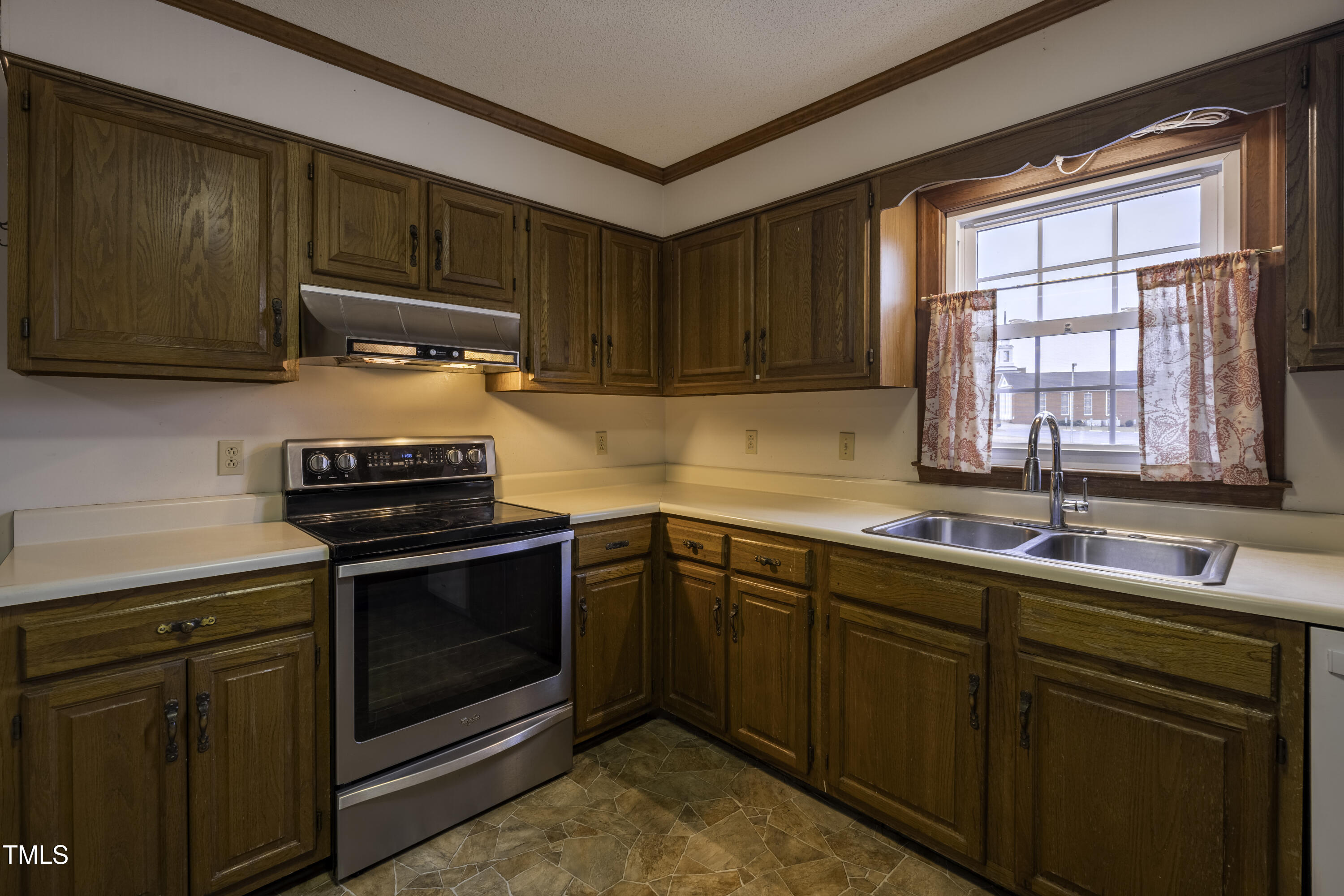 610 Denim Drive Erwin, NC 28339 - Photo 4 of 49 a kitchen with a sink stove and cabinets