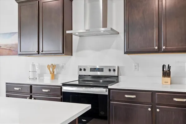 a kitchen with a stove and a sink