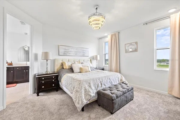 a bathroom with a tub sink and shower