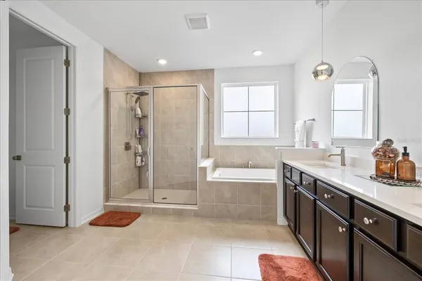 a view of a storage & utility room with closet and a window