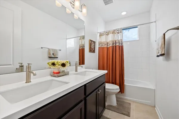 a view of a livingroom with workspace and a couch