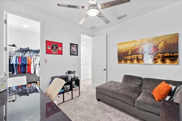 a spacious bathroom with a double vanity sink and a mirror